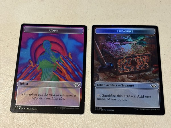 2 x mtg foil token Copy // Treasure, 0001/0018, Outlaws of Thunder Junction