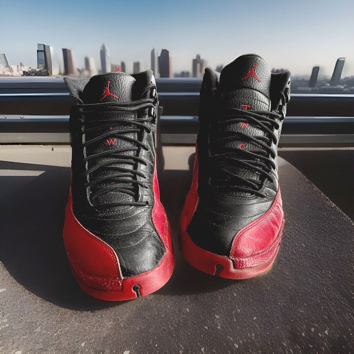 AIR JORDAN 12 XII RETRO SNEAKERS “FLU GAME” BLACK/VARSITY AIR JORDAN 12 XII RETRO SNEAKERS “FLU GAME” BLACK/VARSITY