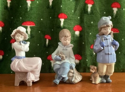 Job lot/Bundle of 3 Nao Lladro Children figurines 2 with puppy, 1 with rabbit - Image 1 of 4