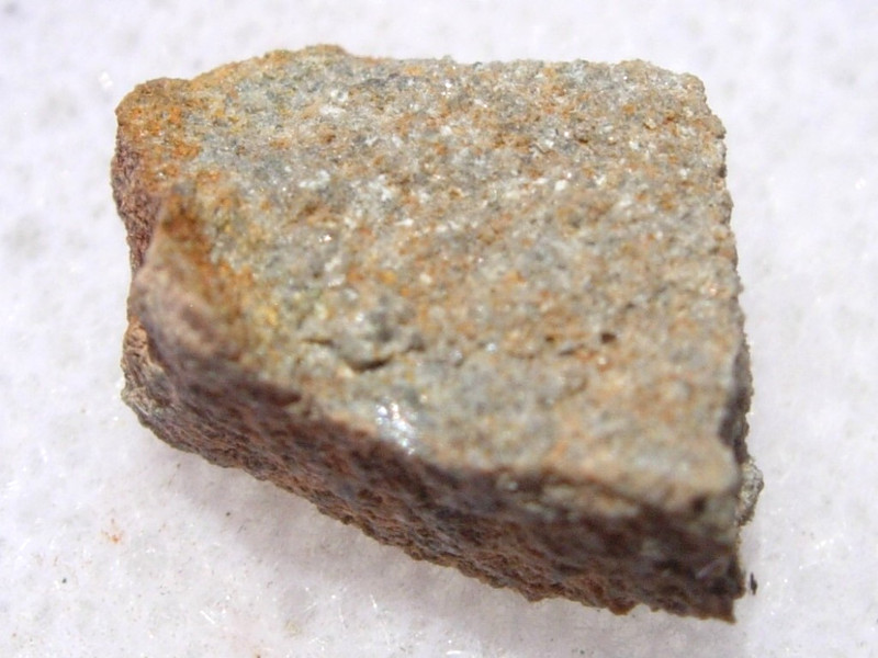 .711 grams NWA 7401 Meteorite ( classified as EL-melt rock ) fragment with a COA