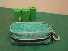 teal dog bags with poop bags for rope/leash