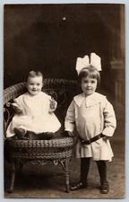 RPPC Portrait Postcard~ Baby Girl & Older Sister In Large Bow