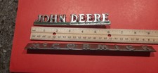 John Deere & McCormick Emblems from Vintage Machinery