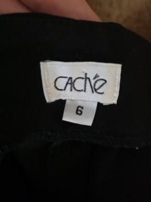 Cache black slim-leg dress pants with a front zipper and no front pockets.
