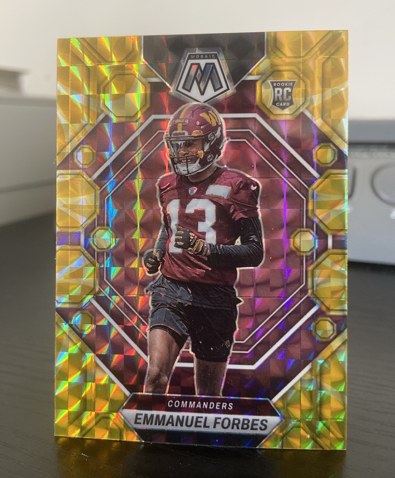 2023 Panini Mosaic #319 Emmanuel Forbes Rookie Reactive Yellow Mosaic Commanders