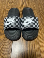 Nike Victori One Slide sandals, featuring a graphic print strap with "JUST DO IT