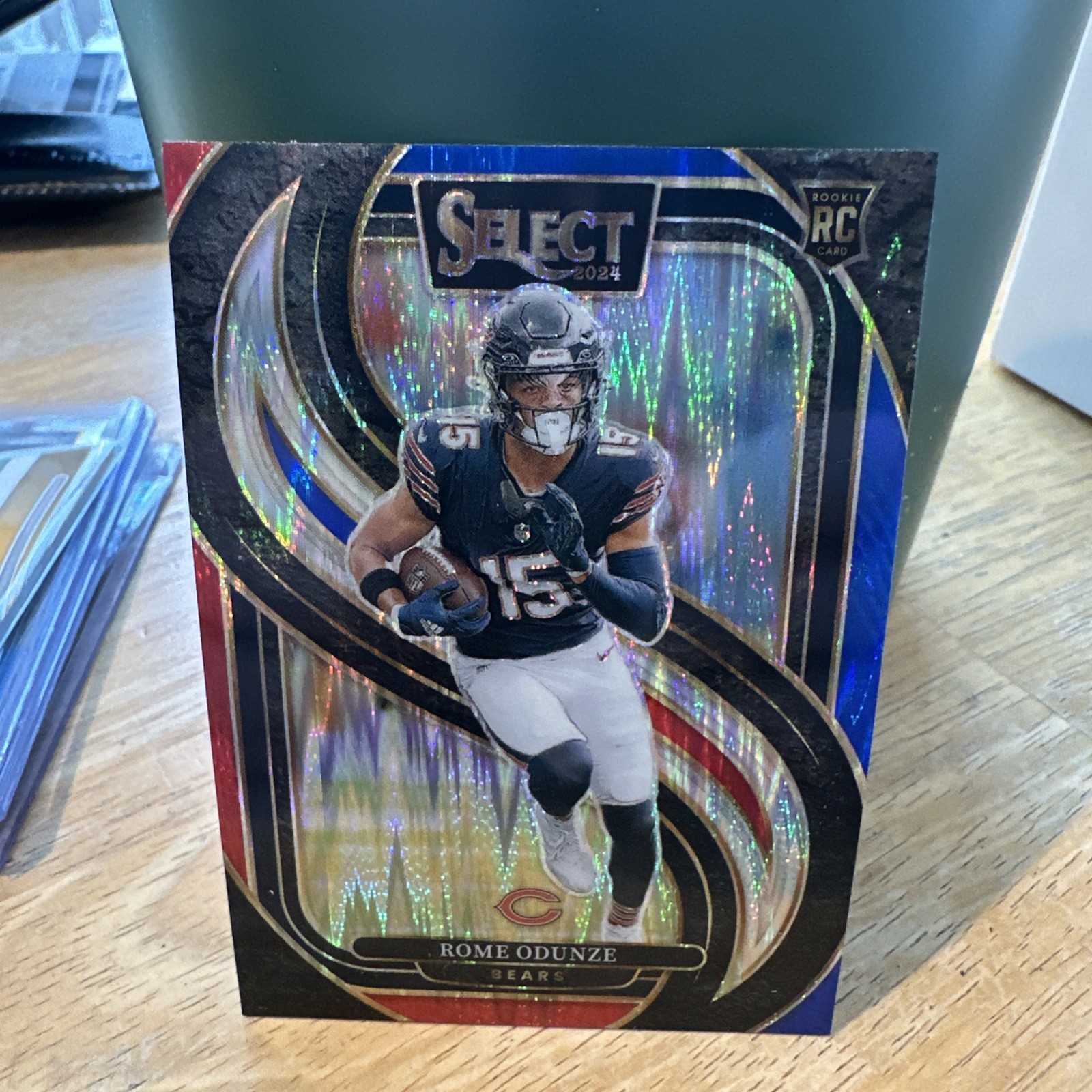 2024 Panini Select - Premier Level Rome Odunze #136 Red & Blue Shock Prizm (RC)