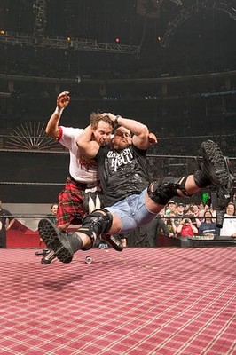 Steve Austin delivers a Stone Cold Stunner to Roddy Piper duri- Wrestling Photo