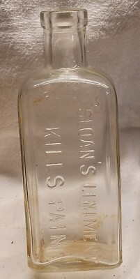 EMBOSSED SLOAN'S LINIMENT KILLS PAIN 3 FL. OZS. CORK TOP BOTTLE
