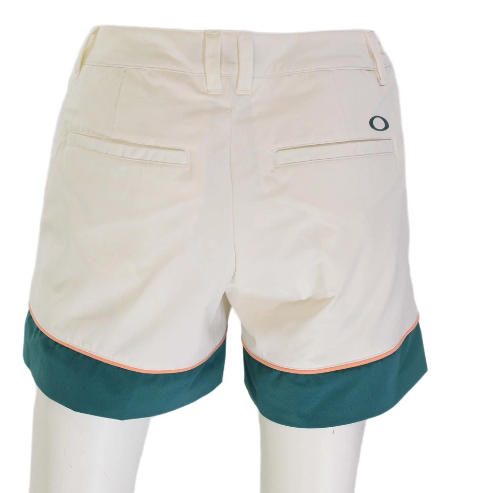 Pantalones cortos de golf Oakley blancos de nailon para mujer M bloques de colores borde melocotón forrados ajuste atlético Foto 2 de 4