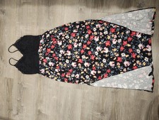 Multi-coloured floral dress with black lining, elastic waist.