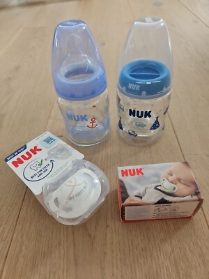 2 unbenutzte Nuk Fläschchen (1x Glas) + Schnuller (1x Nuk Star, 1x Nuk Genius)