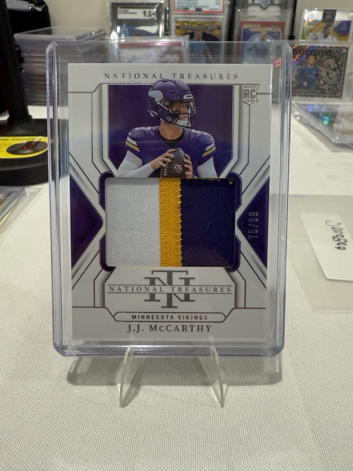 2024 Panini National Treasures - Rookie Patches J.J. McCarthy #214 /99 (MEM, RC)