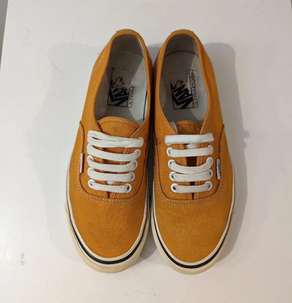 Mustard yellow top low top vans