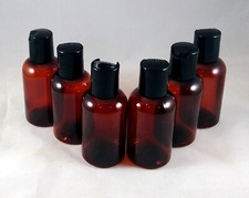 Amber PET 2oz Boston Round Plastic Bottles w Disc Top Dispensing Cap