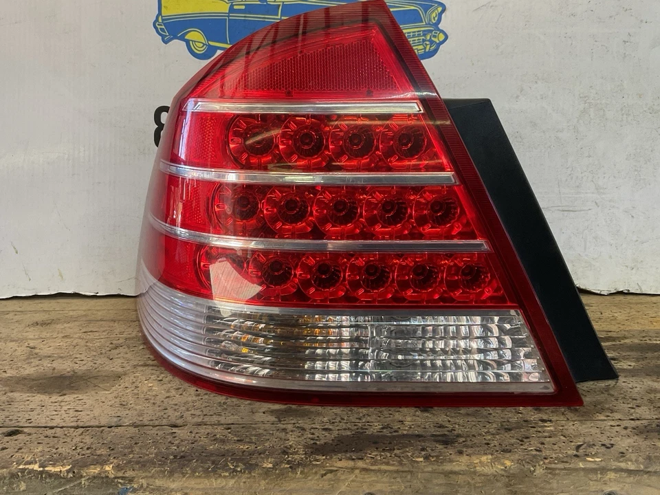 Conjunto de luz trasera lateral izquierda Mercury Montego 2005-2007 con arnés pieza OEM Foto 3 de 4