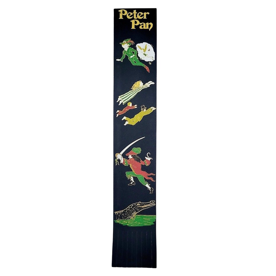 A 2004 Y2K-era leather bookmark set depicting Peter Pan characters crafted in Great Britain — a tiny, exquisite piece of bookish nostalgia with serious collectible charm.