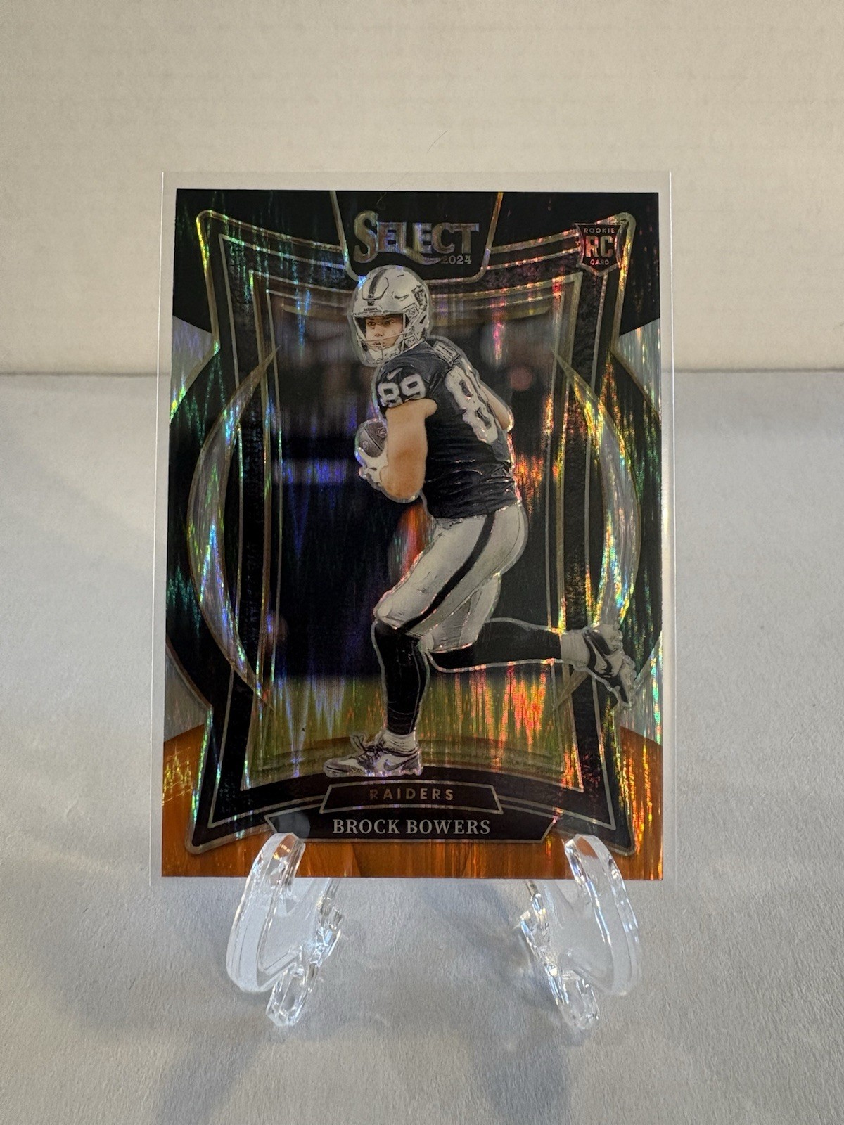 2024 Panini Select - Brock Bowers #31 Black & Orange Shock Prizm (RC) (Z)