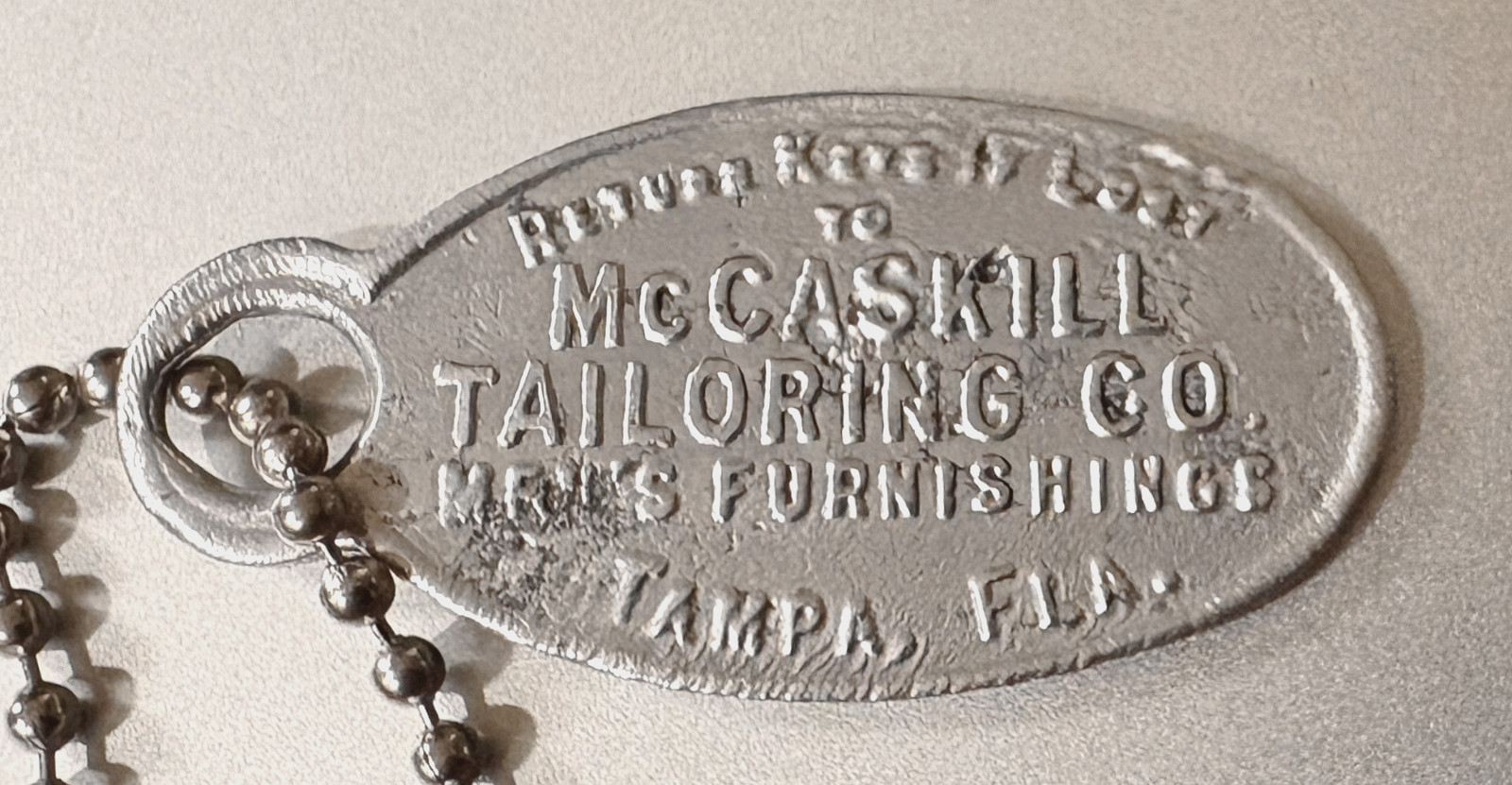 VTG Charge Coin Tag: McCASKILL TAILORING CO; Tampa FL; Men's Furnishings #492