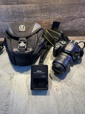 Nikon D5100 + Nikkor 18-55mm Kit