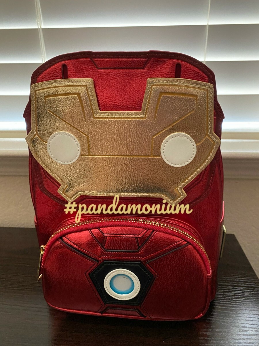 iron man mini cosplay backpack 15th Anniversary Lift up mask to reveal Tony Star Light Up Arc Reactor Metallic Vegan Leather Coordinating pattern on the inside lining Bag Dimensions Loungefly Marvel Iron Man Light