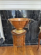 vintage footed copper planter, also known as a jardiniere or urn, brass handles