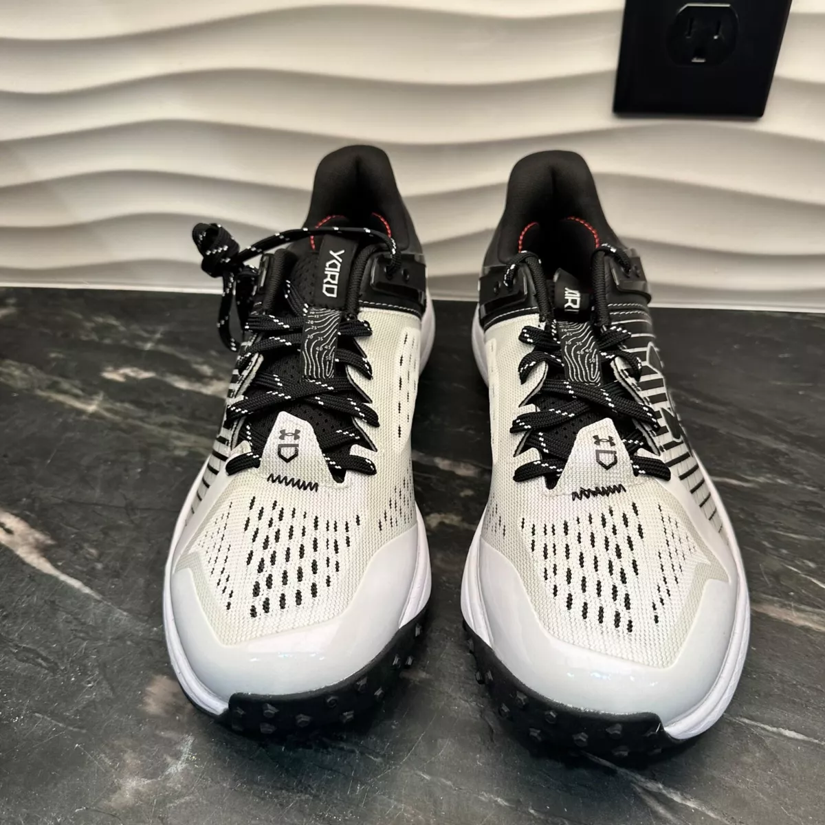 Under armour black shop and white cleats