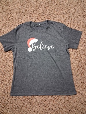 Women's dark gray large T-shirt features Santa hat and the word Believe 
