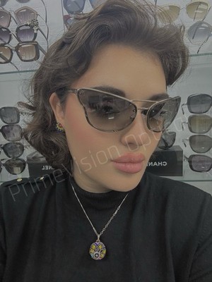 Prada SPR74V butterfly sunglasses with a metal frame and gradient lenses