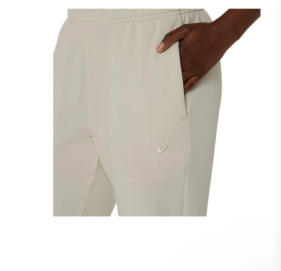 Pantalones de chándal Asics crema Foto 2 de 4