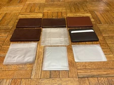 5 different vintage leather credit card holders and 4 plastic wallet inserts