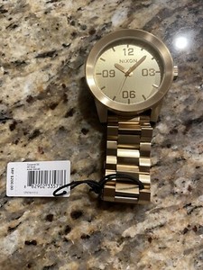 nixon corporal gold