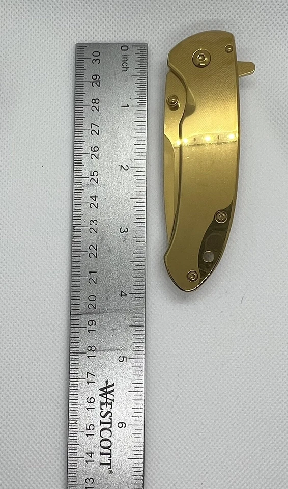 CUCHILLO DE APERTURA ASISTIDA POR RESORTE 4,5” ACABADO ORO TITANIO HOJA ACERO INOXIDABLE Foto 3 de 4