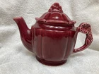 vintage 1940s Shawnee Pottery teapot in the "Rosette" pattern and cranberry/burg