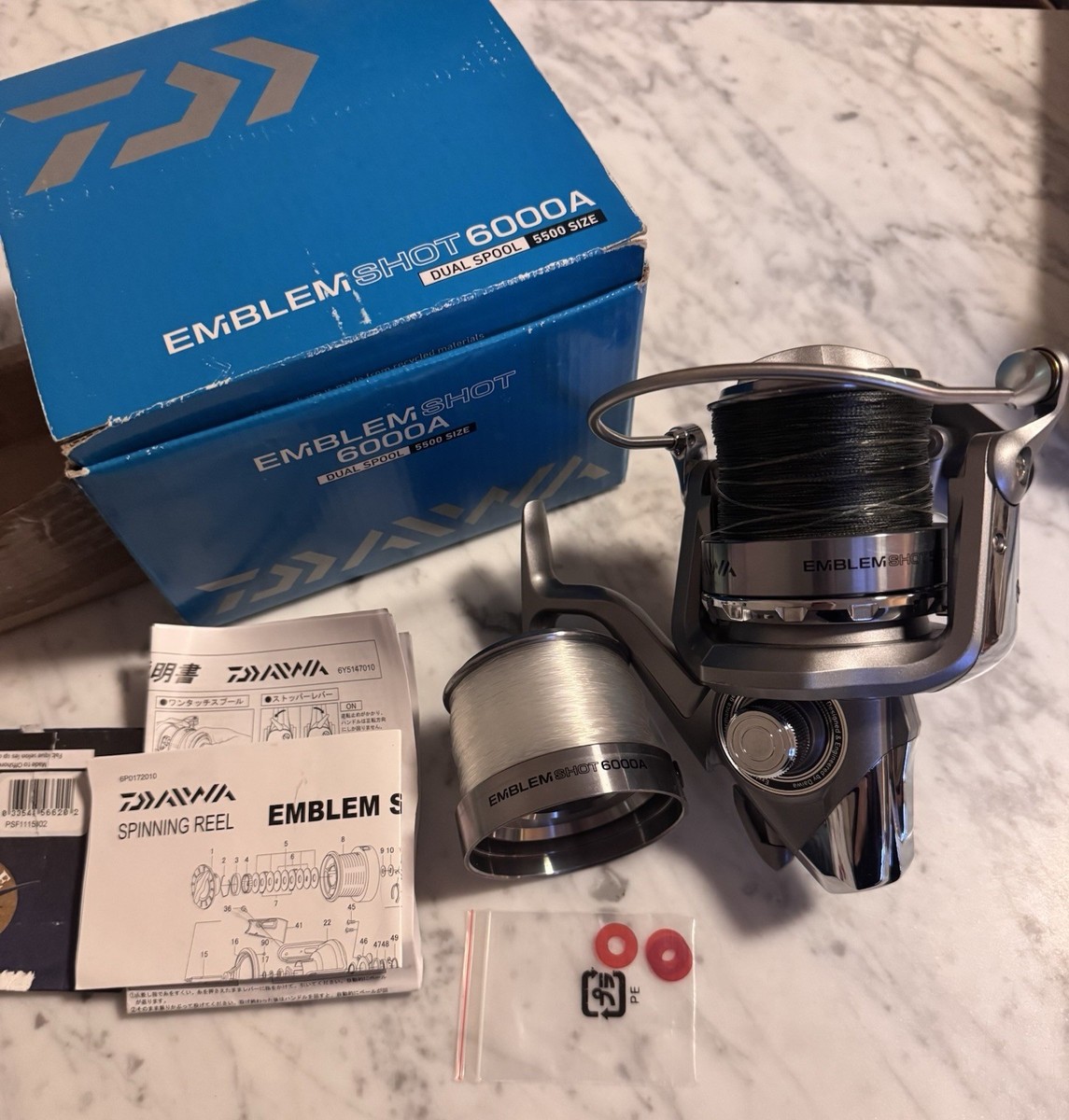 Fishing reel and lures. Daiwa Emblem Pro 6000A. Saltwater Surf