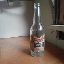 YUENGLING POTTSVILLE,PA EMB BOTTLE WITH 1933 DATED LABEL YUENGLING'S PRIZE BEER