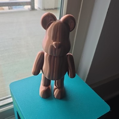 Copper bearbrick style figurine 