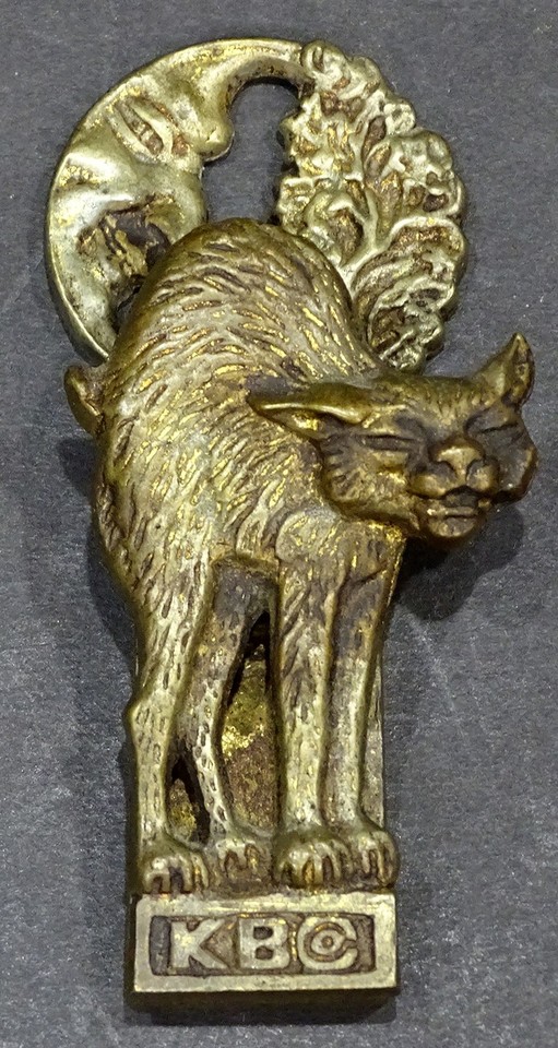 A rare antique Keeler brass Halloween cat desk clip — a 100+ year old functional sculpture that doubles as a spooky conversation piece.