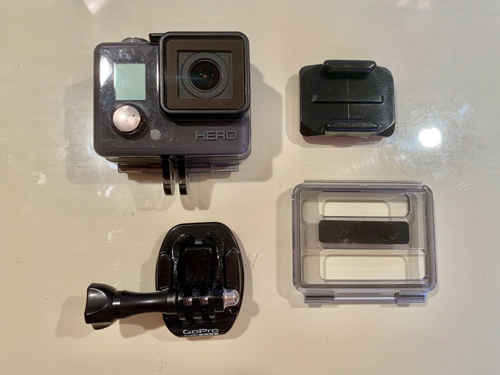 GoPro Hero including Base, MicroSD Card, Waterproof Protective Casing (Used)-image