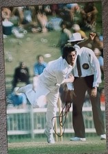 jeff thomson Australia bowls a fast ball during the test match signed 12x8 photo