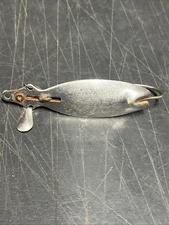 Vintage Marvelure The fully weedless wiggler stainless steel and red. (A24)