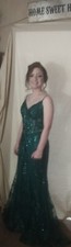 Beautiful emerald green prom dress. size large fits size 11. worn 3 hours. like