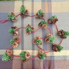 Holiday Christmas garland with pinecones on red rope 9 feet