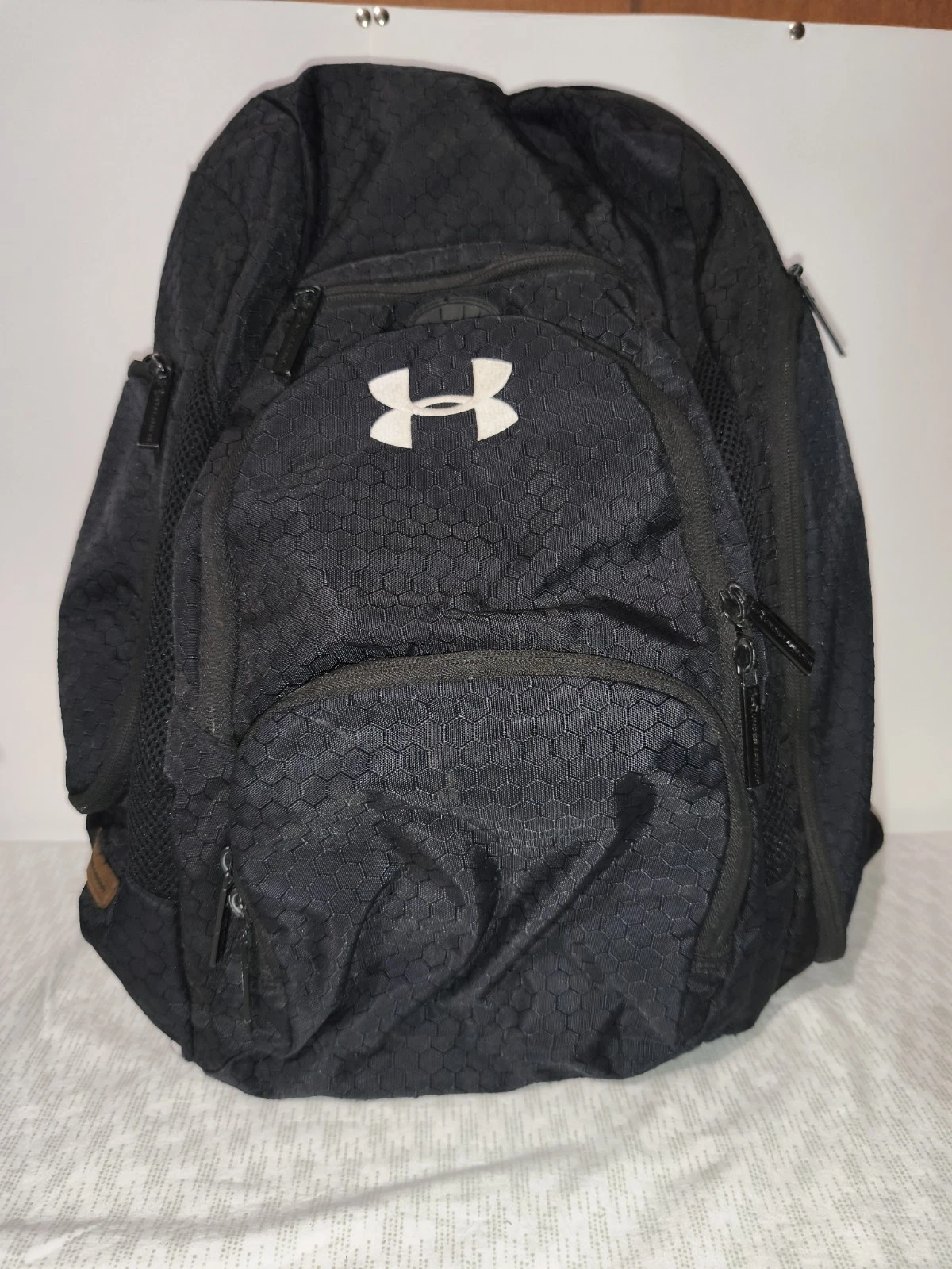 black Under Armour backpack with a white logo