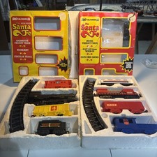 Santa Fe battery operated and windup train sets. Combining both sets.