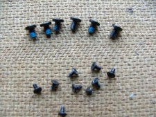 Apple MacBook Pro A1425 Logic Board Screws and hinge screws.