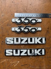 Suzuki T350 Fuel Gas Tank Badge & side panel emblems originals.