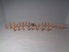 PLASTICVILLE VINTAGE NEW UNPAINTED PEOPLE. SET OF 26 WITH GREEN BENCH.