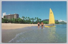 Hale Koa Hotel with Couple and Sailboat on Waikiki Beach HI c1960s Postcard