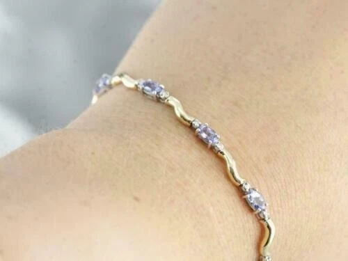 Brazalete de tenis de tanzanita simulada de corte ovalado de 8 quilates enchapado en oro de plata 925 Foto 2 de 4